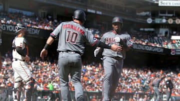 Apr 21, 2016; San Francisco, CA, USA; Arizona Diamondbacks catcher Chris Hermann (10) and outfielder Rickie Weeks Jr (5) react after both scoring on a triple by second baseman Jean Segura (not pictured) in the ninth inning against the San Francisco Giants at AT&T Park. Mandatory Credit: Lance Iversen-USA TODAY Sports