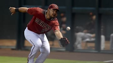 Jul 3, 2016; Phoenix, AZ, USA; Arizona Diamondbacks right fielder Yasmany Tomas (24) is unable to catch a pop fly in foul territory during the first inning against the San Francisco Giants at Chase Field. Mandatory Credit: Joe Camporeale-USA TODAY Sports