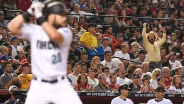 PHOENIX, AZ - SEPTEMBER 06: A fan cheers as Steven Souza Jr. #28 of the Arizona Diamondbacks stands at bat in the fourth inning of the MLB game against the Atlanta Braves at Chase Field on September 6, 2018 in Phoenix, Arizona. (Photo by Jennifer Stewart/Getty Images)