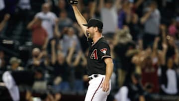 PHOENIX, ARIZONA - AUGUST 14: Starting pitcher Tyler Gilbert #49 of the Arizona Diamondbacks raises his arm in celebration following the final out of his no hitter against the San Diego Padres during the MLB game at Chase Field on August 14, 2021 in Phoenix, Arizona. The Diamondbacks defeated the Padres 7-0. (Photo by Ralph Freso/Getty Images)