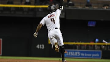 PHOENIX, ARIZONA - AUGUST 30: Ketel Marte #4 of the Arizona Diamondbacks gestures to the fans while rounding the bases after hitting a grand slam home run off of Emilio Pagan #14 of the San Diego Padres during the seventh inning at Chase Field on August 30, 2021 in Phoenix, Arizona. (Photo by Norm Hall/Getty Images)