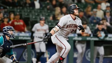 SEATTLE, WASHINGTON - SEPTEMBER 10: Seth Beer #28 of the Arizona Diamondbacks watches his home run during the eighth inning against the Seattle Mariners at T-Mobile Park on September 10, 2021 in Seattle, Washington. (Photo by Steph Chambers/Getty Images)
