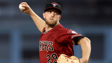 LOS ANGELES, CALIFORNIA - SEPTEMBER 15: Merrill Kelly #29 of the Arizona Diamondbacks pitches against the Los Angeles Dodgers during the first inning at Dodger Stadium on September 15, 2021 in Los Angeles, California. (Photo by Harry How/Getty Images)