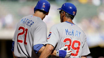 MILWAUKEE, WI - AUGUST 22: Joe Mather #21 of the Chicago Cubs talks to first base coach Dave McKay #39 during the game against the Milwaukee Brewers at Miller Park on August 22, 2012 in Milwaukee, Wisconsin. (Photo by Mike McGinnis/Getty Images)