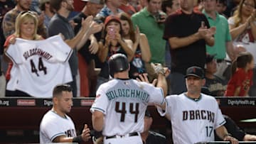 Paul Goldschmidt, greeted by manager Torey Lovullo, needs to pickup his RBI production. (Jennifer Stewart / Getty Images)