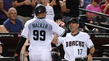 After hitting his first major league home run, Taijuan Walker is greeted by manager Torey Lovullo. (Norm Hall / Getty Images)