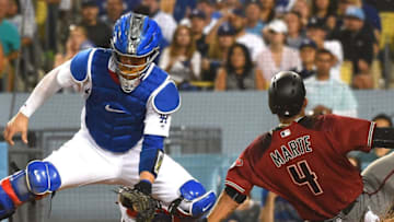 LOS ANGELES, CA - SEPTEMBER 06: Ketel Marte #4 of the Arizona Diamondbacks beats the throw to Yasmani Grandal #9 of the Los Angeles Dodgers to score a run on a double by Adam Rosales #9 of the Arizona Diamondbacks in the seventh inning of the game at Dodger Stadium on September 6, 2017 in Los Angeles, California. (Photo by Jayne Kamin-Oncea/Getty Images)
