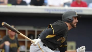 Mar 23, 2015; Port Charlotte, FL, USA; Pittsburgh Pirates right fielder Andrew Lambo (15) hits a RBI single during the fifth inning against the Tampa Bay Rays at Charlotte Sports Park. Mandatory Credit: Kim Klement-USA TODAY Sports