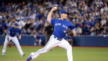 Oct 19, 2015; Toronto, Ontario, CAN; Toronto Blue Jays relief pitcher Liam Hendriks (31) throws against the Kansas City Royals during the ninth inning in game three of the ALCS at Rogers Centre. Mandatory Credit: Nick Turchiaro-USA TODAY Sports