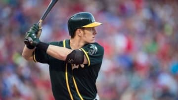 May 2, 2015; Arlington, TX, USA; Oakland Athletics left fielder Mark Canha (20) bats against the Texas Rangers during the game at Globe Life Park in Arlington. The Rangers defeated the Athletics 8-7. Mandatory Credit: Jerome Miron-USA TODAY Sports