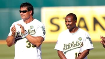Jul 19, 2014; Oakland, CA, USA; Oakland Athletics former players Jose Canseco (33), Tony Phillips on the field during the celebration of the 1989 Oakland Athletics World Series Champions before the game against Baltimore Orioles at O.co Coliseum. Mandatory Credit: Bob Stanton-USA TODAY Sports