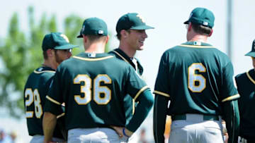 Mar 21, 2016; Scottsdale, AZ, USA; Oakland Athletics starting pitcher Chris Bassitt (40) talks with manager Bob Melvin (6) and third baseman Matt Chapman (36) and second baseman Eric Sogard (28) after being hit by a ball off the bat of San Francisco Giants Miguel Olivio (not pictured) during the second inning at Scottsdale Stadium. Mandatory Credit: Matt Kartozian-USA TODAY Sports
