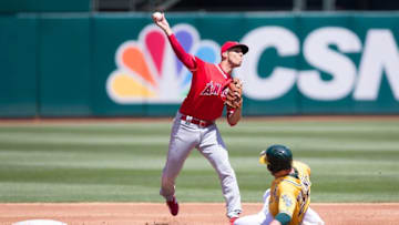 Apr 13, 2016; Oakland, CA, USA; Oakland Athletics third baseman Danny Valencia (26) is forced out at second as Los Angeles Angels shortstop Andrelton Simmons (2) tries to turn a double play in the second inning at O.co Coliseum. Mandatory Credit: Neville E. Guard-USA TODAY Sports
