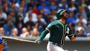 Mar 29, 2016; Mesa, AZ, USA; Oakland Athletics outfielder Andrew Lambo bats against the Chicago Cubs during a spring training game at Sloan Park. Mandatory Credit: Mark J. Rebilas-USA TODAY Sports