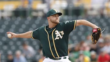 Mar 7, 2016; Mesa, AZ, USA; Oakland Athletics starting pitcher Jesse Hahn (32) throws in the first inning against the Kansas City Royals during a spring training game at HoHoKam Stadium. Mandatory Credit: Rick Scuteri-USA TODAY Sports