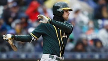 Apr 28, 2016; Detroit, MI, USA; Oakland Athletics right fielder Josh Reddick (22) hits an RBI single in the third inning against the Detroit Tigers at Comerica Park. Mandatory Credit: Rick Osentoski-USA TODAY Sports