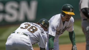 May 30, 2016; Oakland, CA, USA; Oakland Athletics third base coach Ron Washington (38) low five