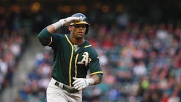 May 25, 2016; Seattle, WA, USA; Oakland Athletics left fielder Khris Davis (2) gives a salute as he runs the bases after hitting a solo homer against the Seattle Mariners during the second inning at Safeco Field. Mandatory Credit: Joe Nicholson-USA TODAY Sports