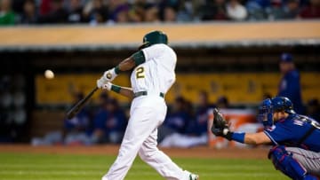 May 16, 2016; Oakland, CA, USA; Oakland Athletics designated hitter Khris Davis (2) hits a sacrifice fly for an RBI against the Texas Rangers in the fourth inning at O.co Coliseum. Mandatory Credit: John Hefti-USA TODAY Sports