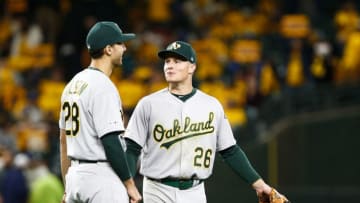 SEATTLE, WA - SEPTEMBER 26: Matt Olson #28 of the Oakland Athletics talks with Matt Chapman #26 as they celebrate their win over the Seattle Mariners at T-Mobile Park on September 26, 2019 in Seattle, Washington. The Oakland Athletics beat the Seattle Mariners 3-1. (Photo by Lindsey Wasson/Getty Images)
