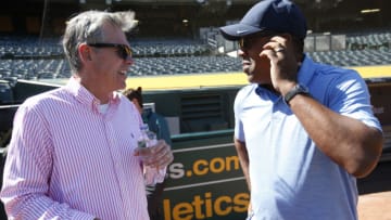 OAKLAND, CA - OCTOBER 1: Executive Vice President of Baseball Operations Billy Beane of the Oakland Athletics talks with Eduardo Perez on the field during a workout at the Oakland-Alameda County Coliseum on October 1, 2019 in Oakland, California. (Photo by Michael Zagaris/Oakland Athletics/Getty Images)