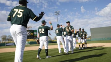 MESA, AZ - February 29: The Oakland Athletics celebrate on the field following the game against the Cleveland Indians at Hohokam Stadium on February 29, 2020 in Mesa, Arizona. (Photo by Michael Zagaris/Oakland Athletics/Getty Images)