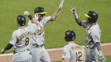 SAN FRANCISCO, CALIFORNIA - AUGUST 14: Stephen Piscotty #25, Khris Davis #2, Sean Murphy #12 and Robbie Grossman #8 of the Oakland Athletics celebrates after Piscotty hit a game tying grand slam against the San Francisco Giants in the top of the ninth inning at Oracle Park on August 14, 2020 in San Francisco, California. (Photo by Thearon W. Henderson/Getty Images)
