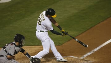 OAKLAND, CALIFORNIA - SEPTEMBER 07: Chad Pinder #18 of the Oakland Athletics hits a double in the bottom of the eighth inning against the Houston Astros at Oakland-Alameda County Coliseum on September 07, 2020 in Oakland, California. (Photo by Lachlan Cunningham/Getty Images)