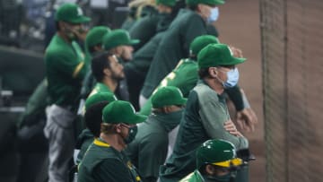 SEATTLE, WA - SEPTEMBER 14: Oakland Athletics manger Bob Melvin wears a blue surgical-style mask in the dugout while watching the second game of a doubleheader against the Seattle Mariners at T-Mobile Park on September 14, 2020 in Seattle, Washington. The Oakland Athletics beat the Seattle Mariners 9-0. (Photo by Lindsey Wasson/Getty Images)