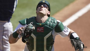 OAKLAND, CALIFORNIA - SEPTEMBER 27: Sean Murphy #12 of the Oakland Athletics tracks a foul pop-up off the bat of Kyle Seager #15 of the Seattle Mariners in the top of the first inning at RingCentral Coliseum on September 27, 2020 in Oakland, California. (Photo by Thearon W. Henderson/Getty Images)