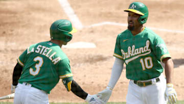 OAKLAND, CALIFORNIA - SEPTEMBER 30: Marcus Semien #10 of the Oakland Athletics is congratulated by Tommy La Stella #3 after he hit a two-run home run against the Chicago White Sox in the second inning of Game Two of the American League wild card series at RingCentral Coliseum on September 30, 2020 in Oakland, California. (Photo by Ezra Shaw/Getty Images)