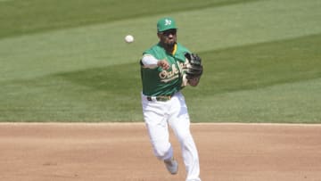 OAKLAND, CALIFORNIA - SEPTEMBER 30: Marcus Semien #10 of the Oakland Athletics throws to first base throwing out Luis Robert #88 of the Chicago White Sox during the fourth inning of Game Two of the American League Wild Card Round at RingCentral Coliseum on September 30, 2020 in Oakland, California. (Photo by Thearon W. Henderson/Getty Images)