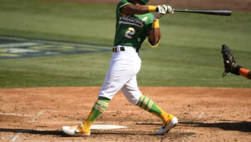 LOS ANGELES, CALIFORNIA - OCTOBER 06: Khris Davis #2 of the Oakland Athletics hits a single against the Houston Astros during the fourth inning in Game Two of the American League Division Series at Dodger Stadium on October 06, 2020 in Los Angeles, California. (Photo by Kevork Djansezian/Getty Images)