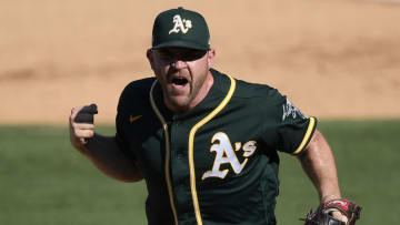 LOS ANGELES, CALIFORNIA - OCTOBER 07: Liam Hendriks #16 of the Oakland Athletics reacts to striking out Josh Reddick #22 of the Houston Astros to end the eighth inning in Game Three of the American League Division Series at Dodger Stadium on October 07, 2020 in Los Angeles, California. (Photo by Kevork Djansezian/Getty Images)