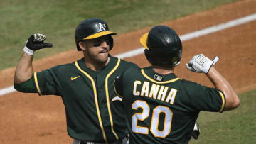 LOS ANGELES, CALIFORNIA - OCTOBER 08: Ramon Laureano #22 of the Oakland Athletics celebrates a three run home run against the Houston Astros with teammate Mark Canha #20 during the second inning in Game Four of the American League Division Series at Dodger Stadium on October 08, 2020 in Los Angeles, California. (Photo by Kevork Djansezian/Getty Images)