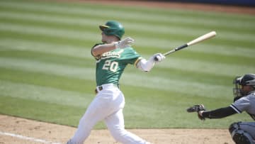 OAKLAND, CA - SEPTEMBER 30: Mark Canha #20 of the Oakland Athletics bats during the game against the Chicago White Sox at RingCentral Coliseum on September 30, 2020 in Oakland, California. The Athletics defeated the White Sox 5-3. (Photo by Michael Zagaris/Oakland Athletics/Getty Images)
