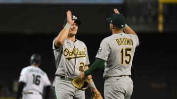 PHOENIX, ARIZONA - APRIL 13: Matt Chapman #26 of the Oakland Athletics celebrates with Seth Brown #15 after a 7-5 win against the Arizona Diamondbacks at Chase Field on April 13, 2021 in Phoenix, Arizona. (Photo by Norm Hall/Getty Images)
