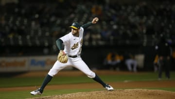 OAKLAND, CA - April 5: Adam Kolarek #21 of the Oakland Athletics pitches during the game against the Los Angeles Dodgers at RingCentral Coliseum on April 5, 2021 in Oakland, California. The Dodgers defeated the Athletics 10-3. (Photo by Michael Zagaris/Oakland Athletics/Getty Images)