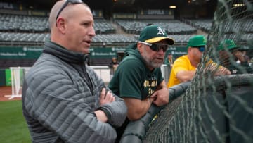 OAKLAND, CA - APRIL 18: General Manager David Forst and Manager Mark Kotsay #7 of the Oakland Athletics on the field before the game against the Baltimore Orioles at RingCentral Coliseum on April 18, 2022 in Oakland, California. The Athletics defeated the Orioles 5-1. (Photo by Michael Zagaris/Oakland Athletics/Getty Images)