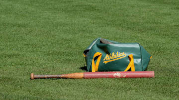 OAKLAND, CA - OCTOBER 08: A detailed view of a Oakland Athletics equipment bag and bat laying on the field during the American League Division Series Workout Day at Oakland-Alameda County Coliseum on October 8, 2012 in Oakland, California. The Detroit Tigers lead the Oakland Athletics 2 games to 0 in the ALDS. (Photo by Mark Cunningham/MLB Photos via Getty Images)