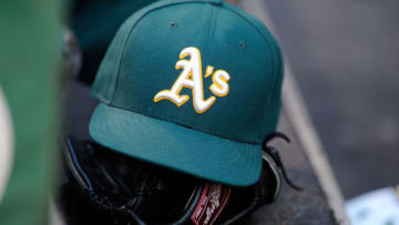 BALTIMORE, MD - AUGUST 15: An Oakland Athletics hat and glove on the steps of the dugout during the game against the Baltimore Orioles at Oriole Park at Camden Yards on August 15, 2015 in Baltimore, Maryland. (Photo by G Fiume/Getty Images)