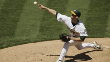 OAKLAND, CA - AUGUST 12: Tim Hudson #15 of the Oakland Athletics pitches during the game against the Detroit Tigers at Network Associates Coliseum on August 12, 2004 in Oakland, California. The Tigers defeated the Athletics 5-3. (Photo by Brad Mangin/MLB Photos via Getty Images)