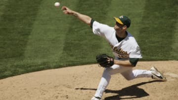 OAKLAND, CA - AUGUST 12: Tim Hudson #15 of the Oakland Athletics pitches during the game against the Detroit Tigers at Network Associates Coliseum on August 12, 2004 in Oakland, California. The Tigers defeated the Athletics 5-3. (Photo by Brad Mangin/MLB Photos via Getty Images)