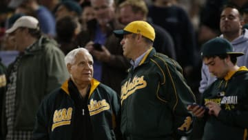 OAKLAND, CA - JULY 19: Owner Lew Wolff and Owner John Fisher of the Oakland Athletics talk in the stands during the game against the Houston Astros at the Oakland Coliseum on July 19, 2016 in Oakland, California. The Athletics defeated the Astros 4-3. (Photo by Michael Zagaris/Oakland Athletics/Getty Images)