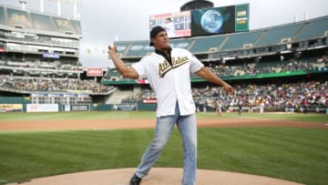 OAKLAND, CA - SEPTEMBER 3: Jose Canseco throws out the ceremonial first pitch prior to the game between the Oakland Athletics and the Boston Red Sox at the Oakland Coliseum on September 3, 2016 in Oakland, California. The Red Sox defeated the Athletics 11-2. (Photo by Michael Zagaris/Oakland Athletics/Getty Images)