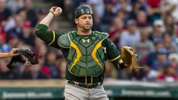 CLEVELAND, OH - MAY 31: Catch Stephen Vogt #21 of the Oakland Athletics throws out Austin Jackson #26 of the Cleveland Indians at first during the eighth inning at Progressive Field on May 31, 2017 in Cleveland, Ohio. The Athletics defeated the Indians 3-1. (Photo by Jason Miller/Getty Images)