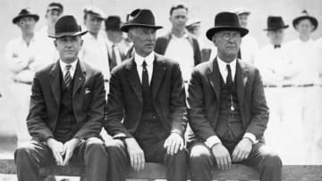 NEW YORK - C.1920. Connie Mack, manager of the Philadelphia Athletics, sits on a bench in Shibe Park with two unidentified assistants about 1920. (Photo Mark Rucker/Transcendental Graphics/Getty Images)