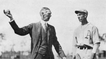 LAKE CHARLES, LOUISIANA - MARCH, 1920. Connie Mack, left, shows a Philadelphia Athletics rookie the finer points of pitching at spring training in Lake Charles, Louisiana in March of 1920. (Photo by Mark Rucker/Transcendental Graphics, Getty Images)