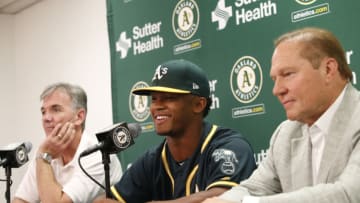 OAKLAND, CA - JUNE 15: Executive Vice President of Baseball Operations Billy Beane of the Oakland Athletics, first round draft pick Kyler Murray and Agent Scott Boras talk during a press conference after Murray signed his contact at the Oakland Alameda Coliseum on June 15, 2018 in Oakland, California. (Photo by Michael Zagaris/Oakland Athletics/Getty Images)