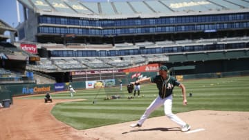 OAKLAND, CA - JULY 8: A.J. Puk #31 of the Oakland Athletics throws in the bullpen during summer workouts at RingCentral Coliseum on July 8, 2020 in Oakland, California. (Photo by Michael Zagaris/Oakland Athletics/Getty Images)
